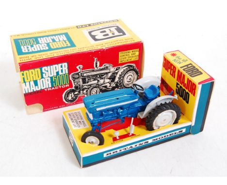A Britains No. 9527 Ford Super Major 5000 tractor comprising of blue and grey body with grey hubs, with air filter and exhaus