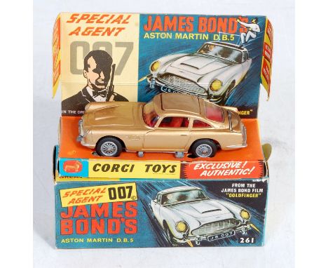 Corgi Toys, 261, James Bond Aston Martin DB5, gold body with red interior, mechanisms in working order, wire work hubs, in th