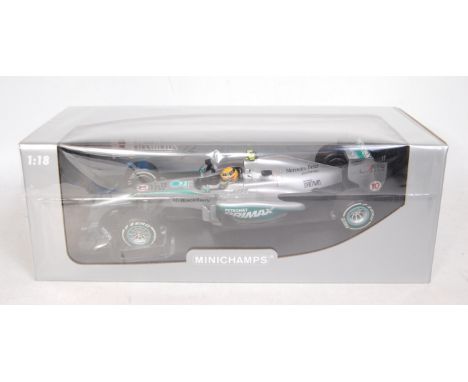 A Minichamps 1/18 scale Mercedes A MG Petronas F1 W04 F1 racing car, Lewis Hamilton, First Podium Malaysian Grand Prix 2013, 