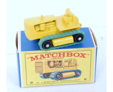 A Matchbox No. 8A Caterpillar Crawler tractor comprising yellow body with green tracks, in the original all-card box (NM-M,BN