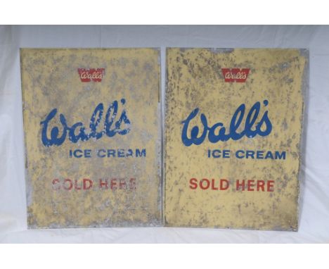 A vintage Wall's ice cream double sided enamel sign
Of shaped form, the blue painted metal frame, enclosing a cream coloured 