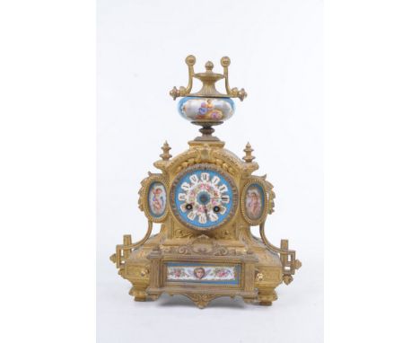 A French Sevres porcelain and ormulu mantle clock
The arched form case, raised of swept acanthus and canted feet, enclosing i