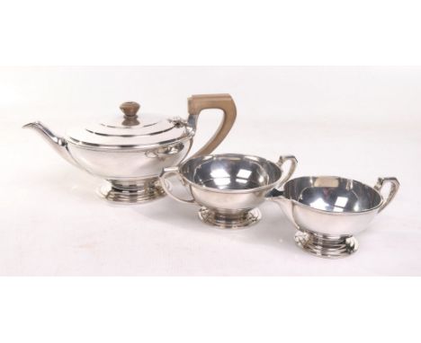 An Art Deco three piece silver tea service
Of flattened circular form, the tea pot lid with an embossed concentric pattern, r