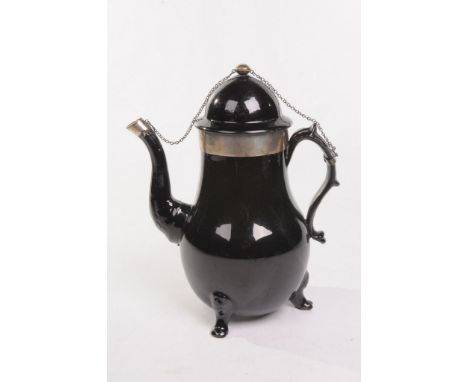 A late 19th Century black pottery teapot, possibly French
Of baluster form, applied with "S" loop handle, scroll spout and do