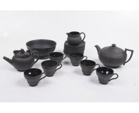 A Wedgwood black basalt tea service
Comprising teapot, six teacups, twelve saucers and milk jug, together with a Wedgwood bla