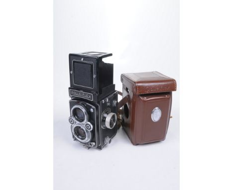 A Rolleiflex Camera
With a Carlzeiss Tessar 1.3.5F 75mm lens complete with leather carry case and carriage strap. (illustrate