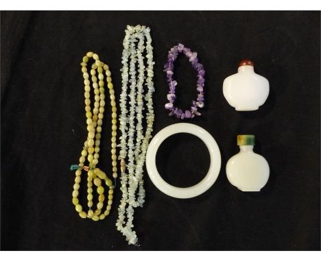 Two Chinese jade snuff bottles, together with a jade bangle, an amethyst bracelet and two necklaces.