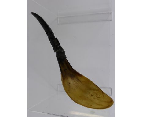 An Antique Native American Horn Ladle,  the handle carved with fish, eagle and bear, possibly Tlingit, approx 28 cms