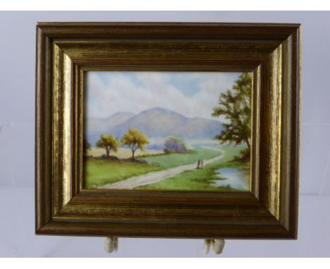 A Hand Painted Porcelain Plaque, depicting a riverside scene, signed lower left Francis Clark, approx 11 x 7.5 cms Note: Fran