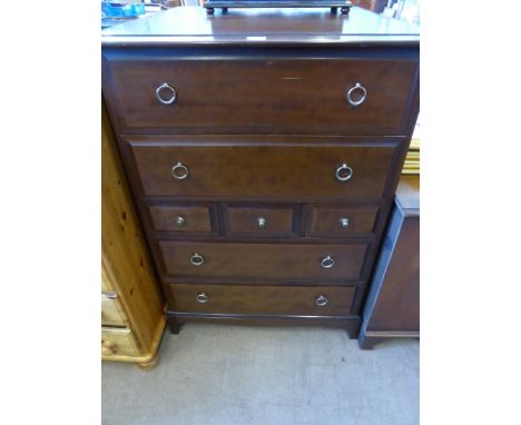 A Pair of Stagg Chests of Drawers, four long drawers and three short, on bracket feet, approx 82 x 47 x 111 cms.