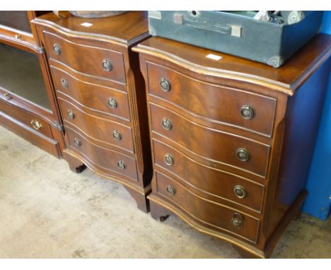 A Pair of Mahogany Bedside Cabinets, serpentine front with four drawers, on bracket feet, approx 50 x 41 x 73 cms.  (2)