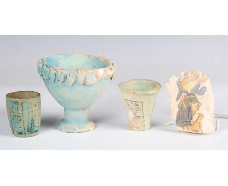 An Egyptian blue glazed faience cup of conical form, decorated with a panel of hieroglyphics, height 6cm, together with a sim