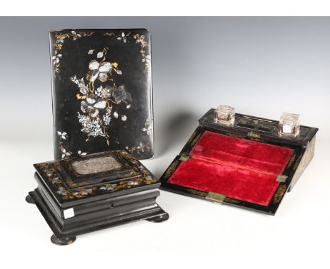 A Victorian papier-mâché needlework box, the lid inset with an electrotype panel within borders of gilt and mother-of-pearl f