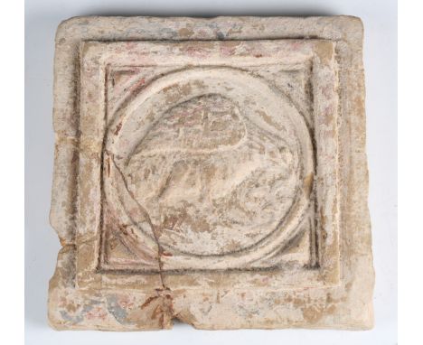 A Roman pottery tile, decorated in relief with a bird and retaining remnants of red and black pigment, 22cm x 22cm (repairs).