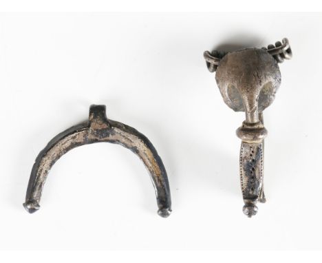 A Continental Roman silver trumpet form fibular brooch, length 3.4cm, together with a Roman silver luna drop pendant, probabl