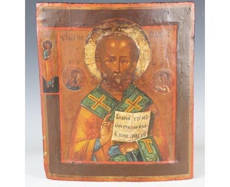 A Russian School painted icon depicting Saint Nicholas holding the Book of Gospels, tempera and gilt on wood panel, 32cm x 27