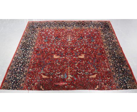 A Sparta carpet fragment, West Anatolia, early 20th century, the pale claret field with recumbent animals, trees and plants, 