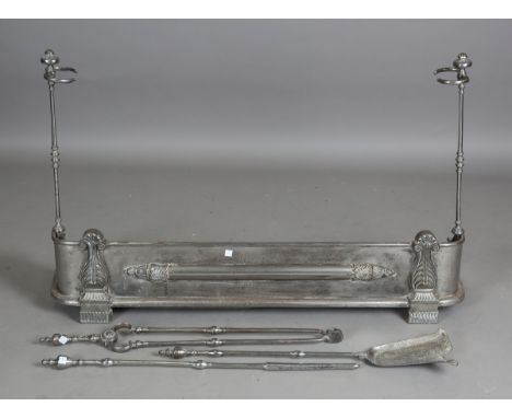 A Regency steel fender with cast acanthus leaf decoration, each end fitted with a removable fire tool stand, width 111cm, tog