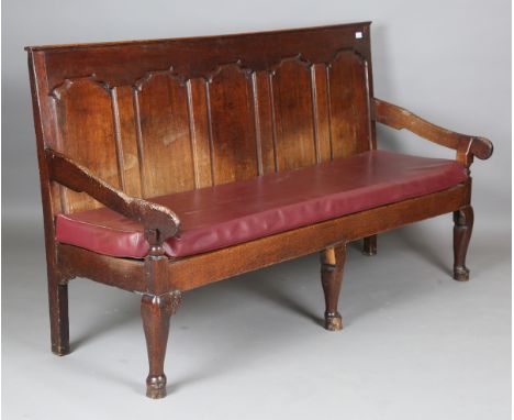 A George III Lancastrian oak panel back settle, raised on cabriole legs, height 105cm, width 187cm, depth 70cm (lacking seat 