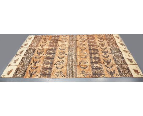 A very large Tongan tapa cloth, decorated in natural pigments with panels of birds, trees, animals and script, 394cm x 220cm.