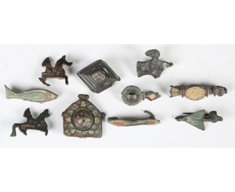 A collection of Romano-British zoomorphic and other plate type brooches, including a sandal, fish, two horse and rider types 