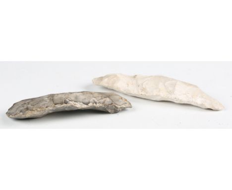Two Sussex-found early Neolithic flint axes, one detailed in black ink 'Cissbury, Vineyard Hill 17/1/70', the other 'Cissbury