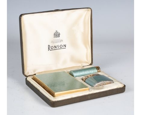 An early/mid-20th century lady's smoking companion set by Ronson, comprising lighter, cigarette case and lipstick, cased.Buye