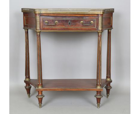 A French Empire mahogany and gilt metal mounted console table, the shaped top inset with white marble above a single frieze d