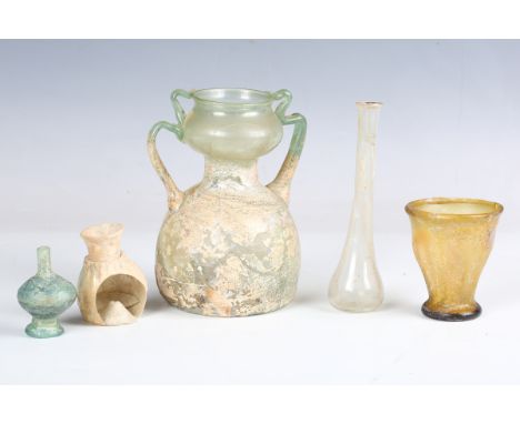 A Roman green glass twin-handled flask, 2nd-3rd century AD, height 15cm, together with four other pieces of Roman glassware, 