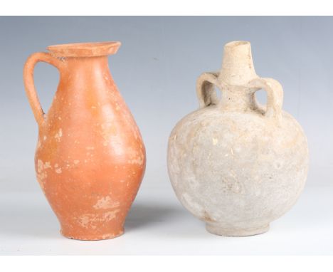 A Roman red ware jug, 2nd-3rd century AD, height 20cm, together with a Roman grey ware twin-handled flask, height 20cm. Prove