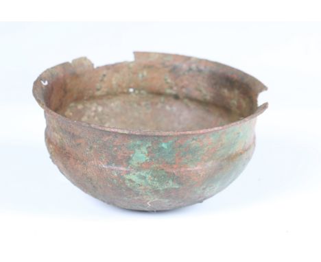 A Roman copper alloy bowl, 2nd-3rd century AD, covered in an overall deep green and brown archaeological patina, diameter 14c