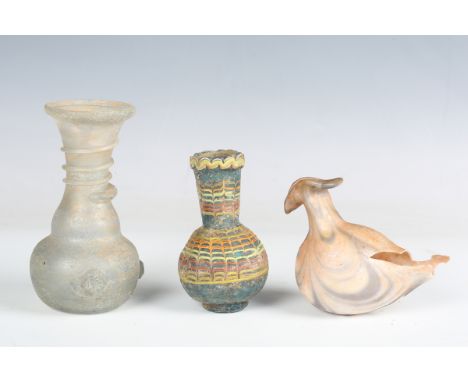 A group of ancient and later glass items, including a Roman glass baby feeder of bird form, 1st century AD (faults). Note: fr