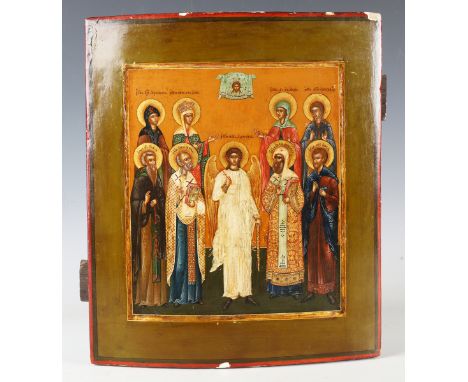 A Russian School painted icon depicting the Guardian Angel flanked by saints and martyrs beneath the Mandylion, tempera and g