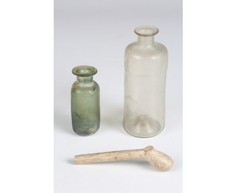Two 18th century glass phials, possibly English, heights 10cm and 6.5cm, together with a fragment of a 17th century clay pipe