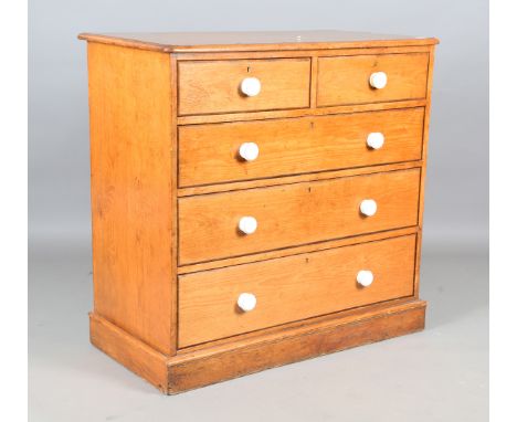 A mid-Victorian pine chest of drawers, the top with kingwood crossbanding, the drawers with later ceramic handles, bearing pa