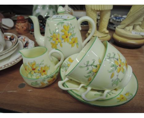 a Crown Staffordshire part tea for two service with yellow floral decoration