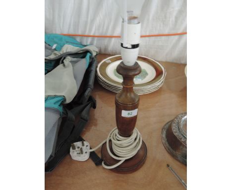 A wood turned table lamp