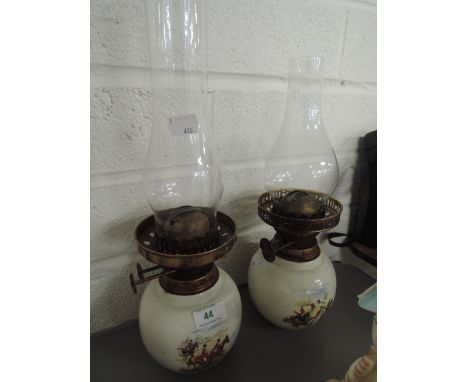 Two ceramic oil lamps with transfer print hunting scenes