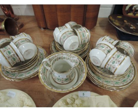 An early 20th century Pointons tea service in green and gilt
