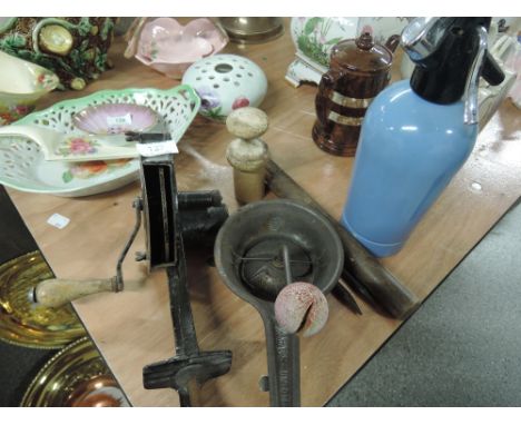A selection of vintage kitchenalia including marmalade cutter, a treen cased cheese thermometer and a Muly potato masher etc