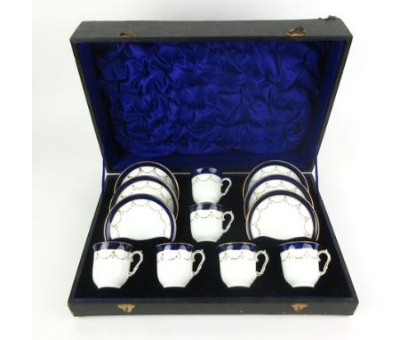 A cased Bisto six sitting tea service decorated with blue and gilt bands, retailed by Harrods of London