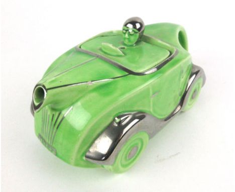 A Sadler teapot modelled as a green racing car, bearing the numberplate OKT42, l. 23 cm   CONDITION REPORT:  Damage and repai