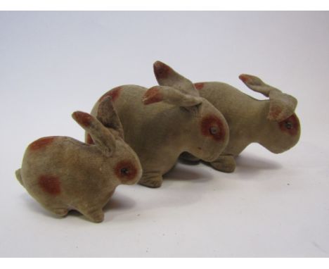 A family of three early 20th Century Steiff rabbits, each made from white velvet with brown markings with black boot button e