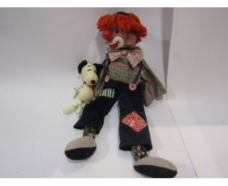 A Pelham ventriloquist dummy and a Snoopy puppet
