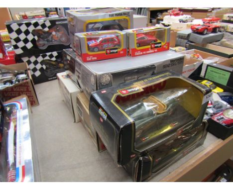 Nine boxed diecast Burago cars, various scales 