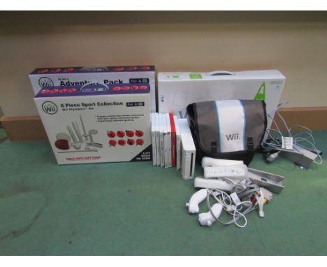 A Nintendo Wii games console in carry case with controllers, boxed Wii Fit , Pair and Go 8 piece Sport Collection and Adventu
