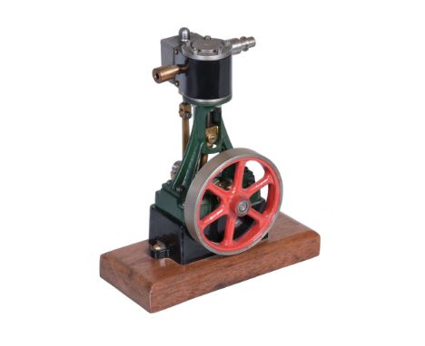  A model of a Stuart Turner 10V vertical steam engine,   having metal clad cylinder supported on trunk guide with eccentric d