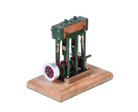  A small live steam twin simple vertical marine engine,   built to the drawings by Rudy Kouhoupt with twin cylinders 1/2 inch