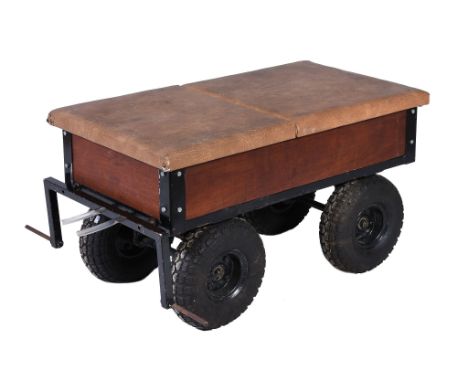  A four wheeled driving trailer,   suitable for use with a traction engine and being of welded construction with wooden sides