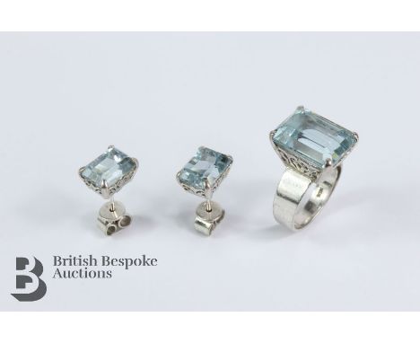 14/15ct white gold and aquamarine dress ring. The emerald-cut aquamarine measures 14 x 11mm, size K+, 6.96 gms, together with